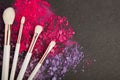 White make up brushes and violet and pink eyeshadows Royalty Free Stock Photo