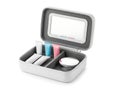 White makeup brush holder with compartments and colorful brushes inside white brush holder Royalty Free Stock Photo