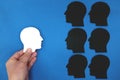 White male silhouette head profile facing shadows in blue background. Face fears, stress and depression. Royalty Free Stock Photo