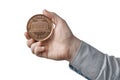 White man in blue shirt hold a big american penny one cent in his hand. on white background