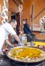 Man cooking a seafood paella