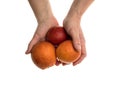 White man holds a blood orange in his hand Royalty Free Stock Photo