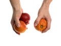 White man holds a blood orange in his hand Royalty Free Stock Photo