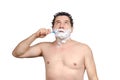 White man holds a toothbrush, shaving and looks up Royalty Free Stock Photo