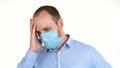 White man in protective mask feeling feeling unwell. Malaise, first symptoms, illness, stress, depression, headache