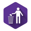 White Man throwing trash into dust bin icon isolated with long shadow. Recycle symbol. Purple hexagon button Royalty Free Stock Photo