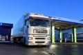 White Man 18.480 Truck and Trailer at a Filling Station