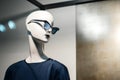 White mannequin female in blue fashionable glasses and dress. Royalty Free Stock Photo