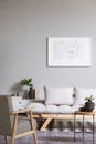 Map on grey wall in fashionable living room interior with scandinavian futon