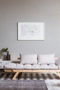 map on grey wall in fashionable living room interior with scandinavian futon Royalty Free Stock Photo