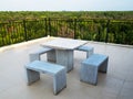 White marble bench table desk and marble chair on roof top with green natural mangrove view Royalty Free Stock Photo