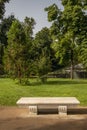 White marble bench in an urban park Royalty Free Stock Photo