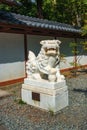 White marble chinese lion statue at the main gate of The Kamakura Daibutsu - Great Buddha of Kamakura Royalty Free Stock Photo