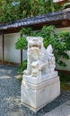 White marble chinese lion statue at the main gate of The Kamakura Daibutsu - Great Buddha of Kamakura Royalty Free Stock Photo