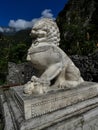 White marble chinese style lion and baby statue on decorative re Royalty Free Stock Photo