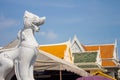 White marble leo guarding the entrance of the temple in Thailand