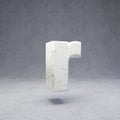 White marble letter R lowercase on concrete background
