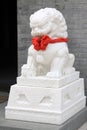 White marble lion sculpture in a park Royalty Free Stock Photo