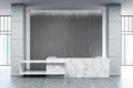 White marble reception, gray blinds