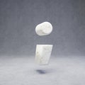 White marble semicolon symbol on concrete background