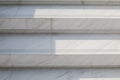 White marble stairs of a corridor with sunlight. Beautiful natural stone modern building. Royalty Free Stock Photo