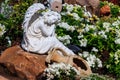 White marble statue of angel in ornamental garden Royalty Free Stock Photo