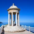 White marble stone gazebo high above a sea