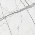 White marble surface with distinctive gray veining creates an elegant pattern. The veins vary in Royalty Free Stock Photo