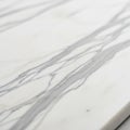 White marble surface featuring natural grey veining. The smooth texture and elegant Royalty Free Stock Photo