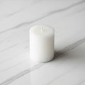White marble surface with subtle gray veining. The candle is unlit, Royalty Free Stock Photo
