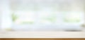 White marble table top on blur kitchen window background.