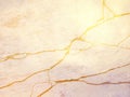 White marble or travertine with golden veins - abstract background Royalty Free Stock Photo