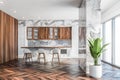 White marble and wood kitchen interior with bar Royalty Free Stock Photo