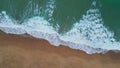 White marine foam washing sand closeup. Aerial turquoise water rolling seashore Royalty Free Stock Photo