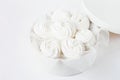 White marshmallow in a white box on a light background. Horizontal frame. Selective focus Royalty Free Stock Photo