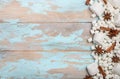 White Marshmallows and Winter Spices on Blue Wooden Background