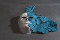 White theater mask on a black background covered with leather flaps. Psychic symbol of overlapping layers Royalty Free Stock Photo