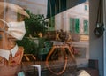 White-mask dummy inside a closed shop window Royalty Free Stock Photo