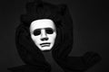 White masks playing dress up for the masquerade ball with a black cloth Royalty Free Stock Photo