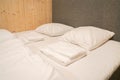 White mattress and comfortable pillows in hotel double bedroom for couple honeymoon Royalty Free Stock Photo