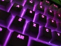 White Mechanical Keyboard With Purple Illuminated Caps