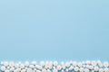 White Medical Pills on Blue Background Royalty Free Stock Photo