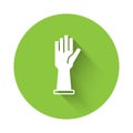 White Medical rubber gloves icon isolated with long shadow. Protective rubber gloves. Green circle button. Vector