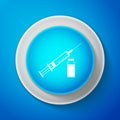 White Medical syringe with needle and vial icon isolated on blue background. Concept of vaccination, injection. Circle Royalty Free Stock Photo