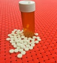 White medical tablets and container