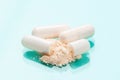 White medicine capsules probiotic powder inside. Close up. High resolution product. Health care concept - Image Royalty Free Stock Photo