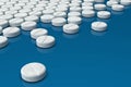 White medicine pills arranged on blue background Royalty Free Stock Photo