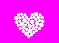 White medicine pills in the shape of a heart on a pink background top view with copy space Royalty Free Stock Photo