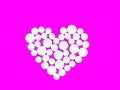 White medicine pills in the shape of a heart on a Violet background top view with copy space. Royalty Free Stock Photo