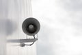 White megaphone, loud speaker close-up. Hanging on the wall. Royalty Free Stock Photo